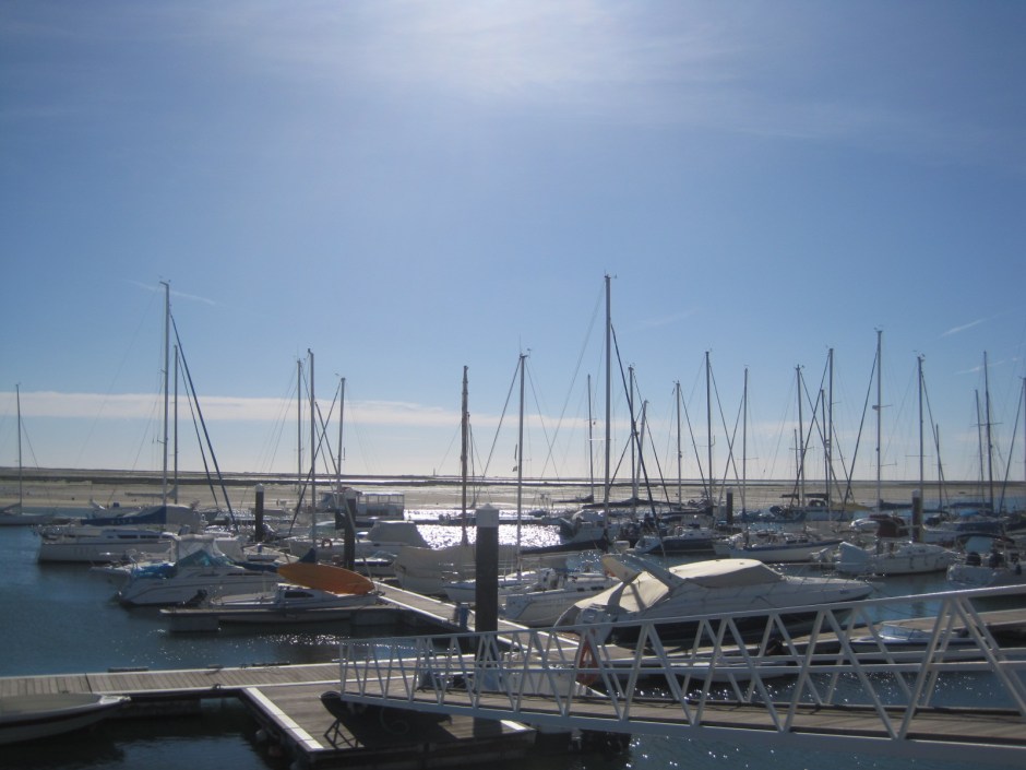 Can you make out the lighthouse at Farol on the island of Culatra between those masts?