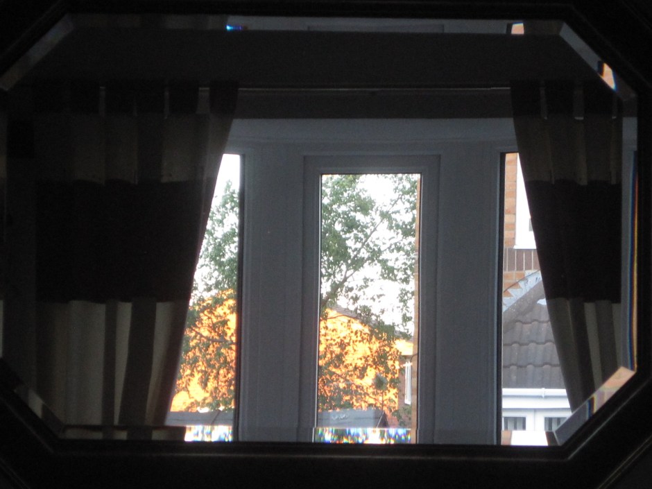 Our front window reflected in the mirror (no, I never clean that!)