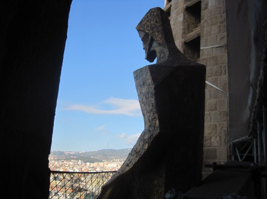 This figure looks down on the city- with compassion?