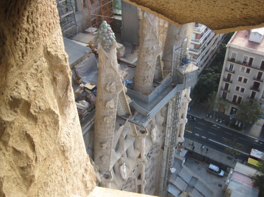 While the workers whizz up and down on cables.