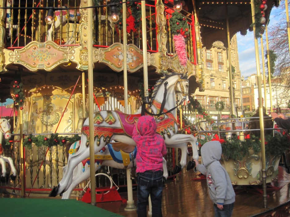 The children looked up hopefully at the carousel horse. 