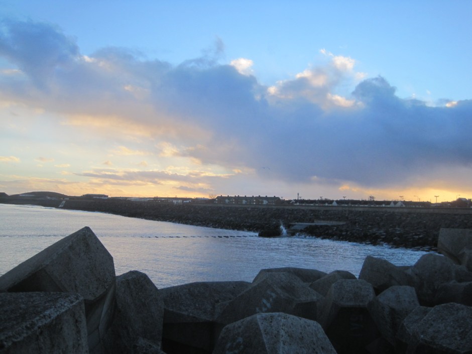 Sea defences softened by   sunset