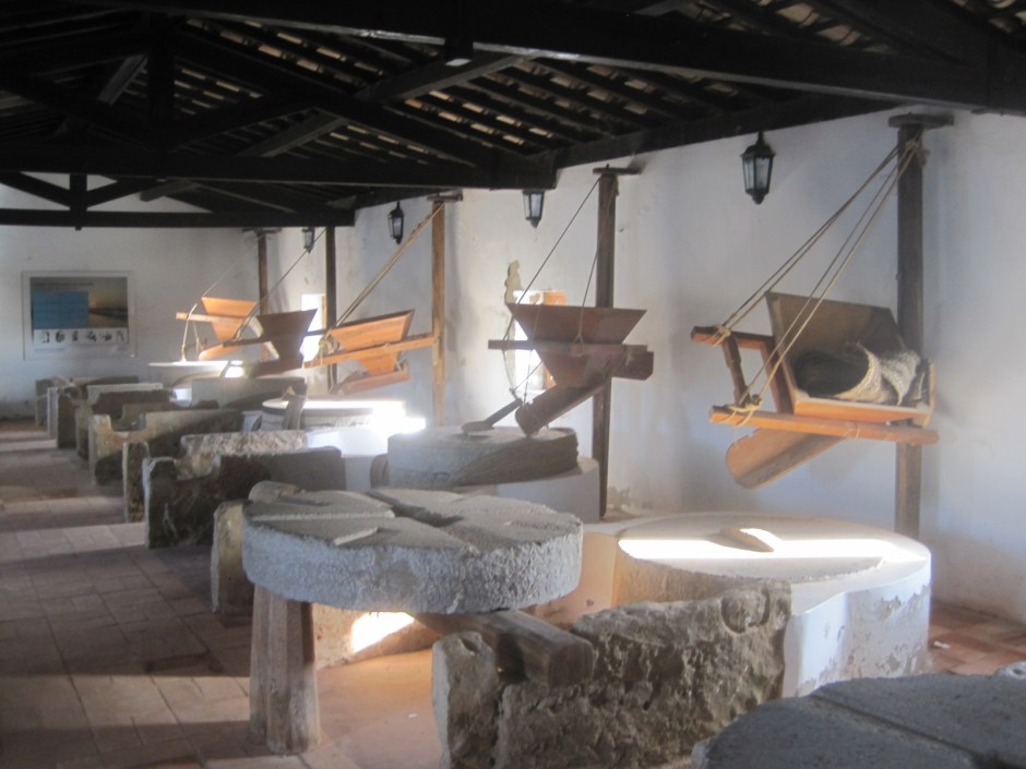 Light floods in, illuminating the mill wheels