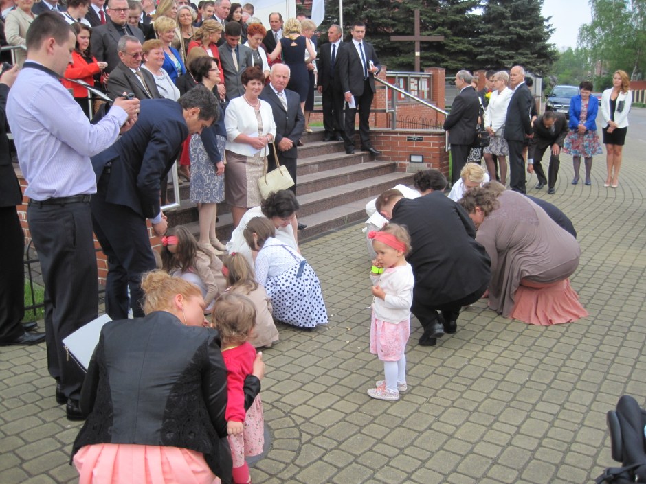 The children helping to pick up the 'lucky' coins
