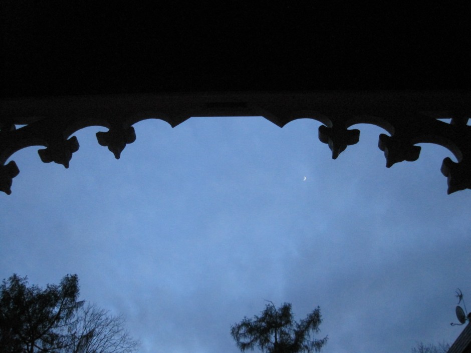 From the porch the tiniest crescent of moon is visible