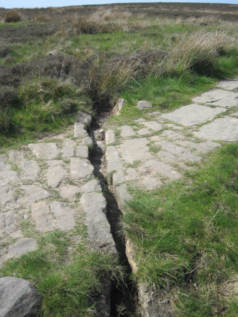 With runnels to help the rains to drain away