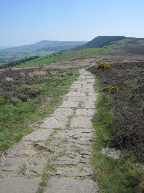 The waymarked trail leads off across the moors