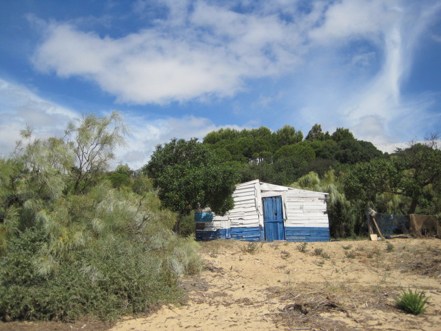 With a couple of dilapidated shacks