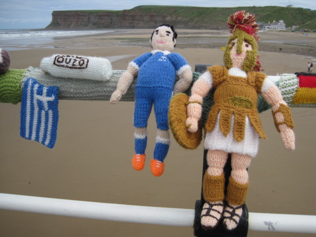 Greece seem to have brought along a gladiator to help!