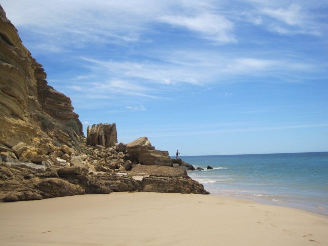And a man fishing from the rocks
