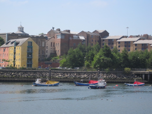 A number of boats are casually moored