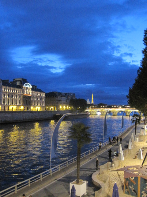 While the 'real' tower sparkles distantly