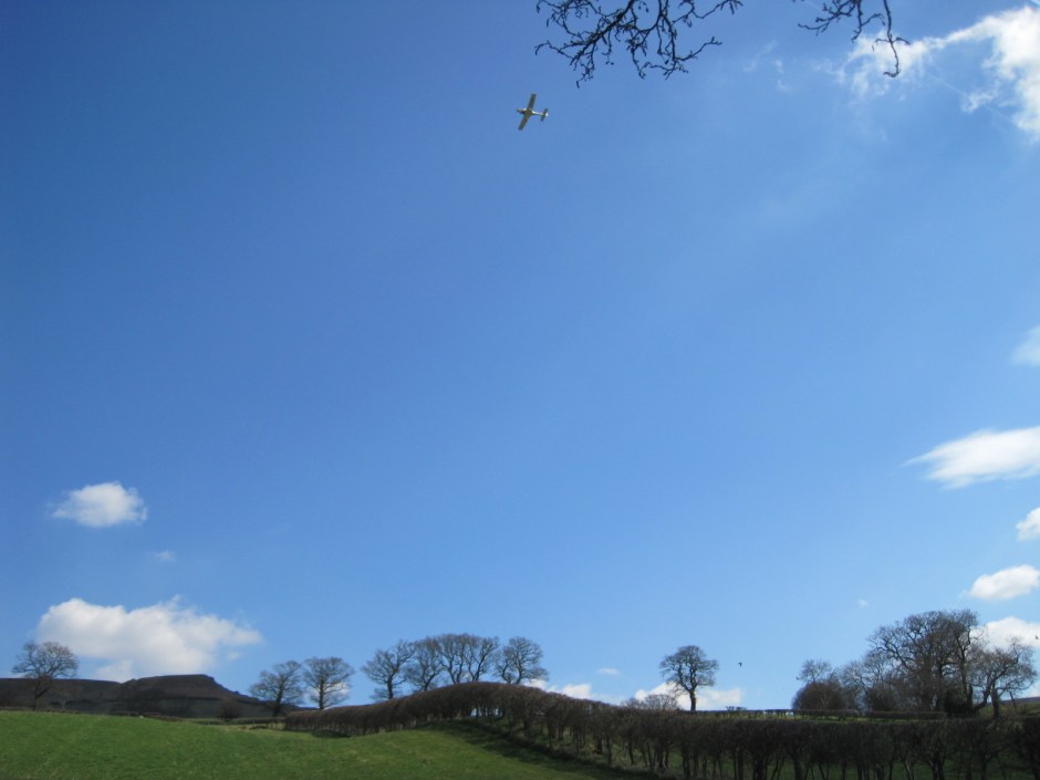 And then a low-flying plane drones past