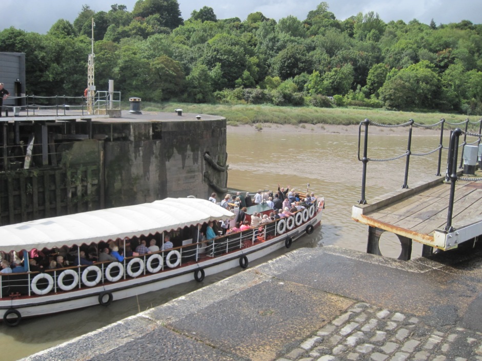 A tour boat passes through the lock