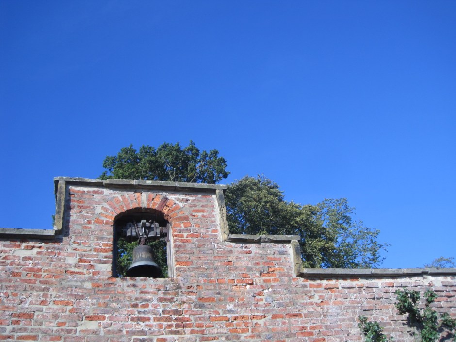 An old bell set high in the wall